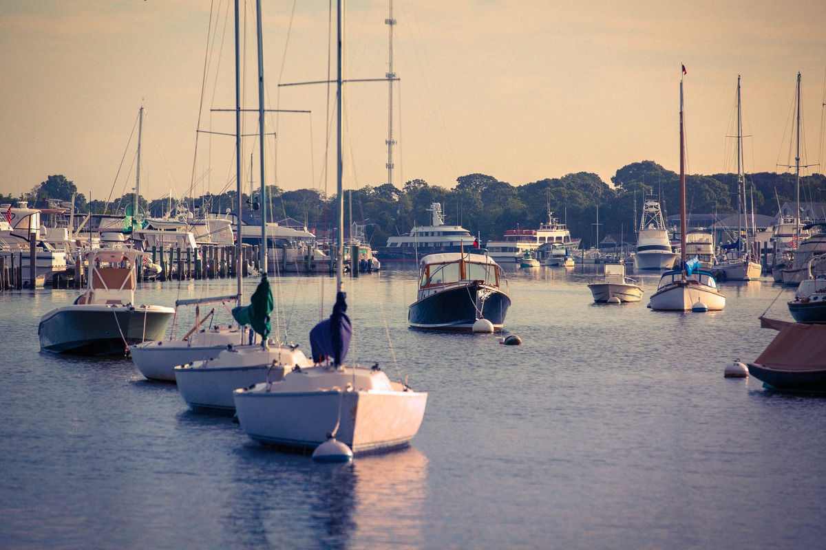 Falmouth Harbor at sunrise with moored sailing boats